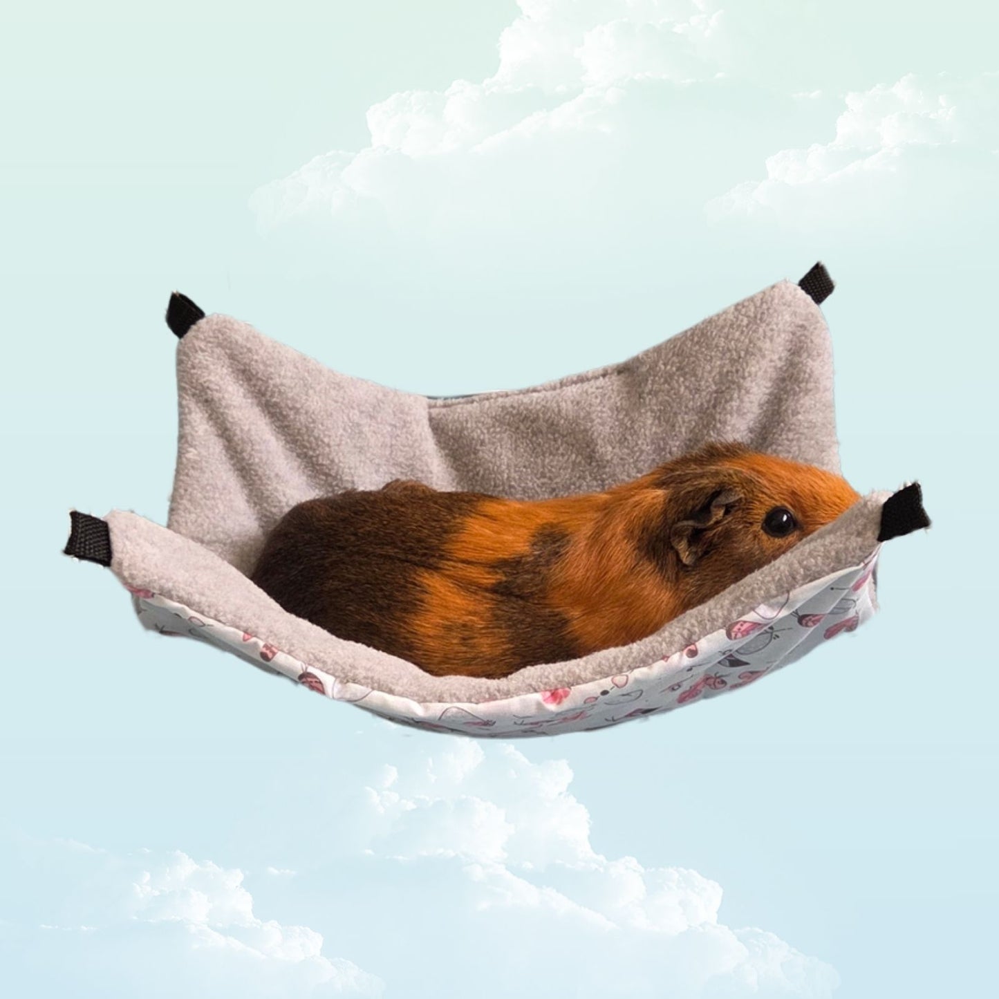 Handmade Reversible Snuggle Hammock for Small Animals - Blue Feathers and Grey with a guinea pig laying