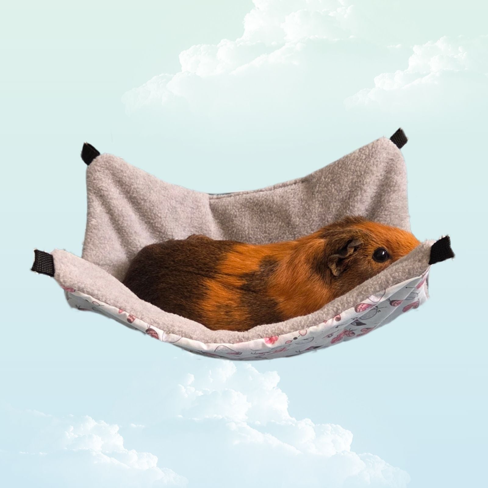 Handmade Reversible Snuggle Hammock for Small Animals - Blue Feathers and Grey with a guinea pig laying
